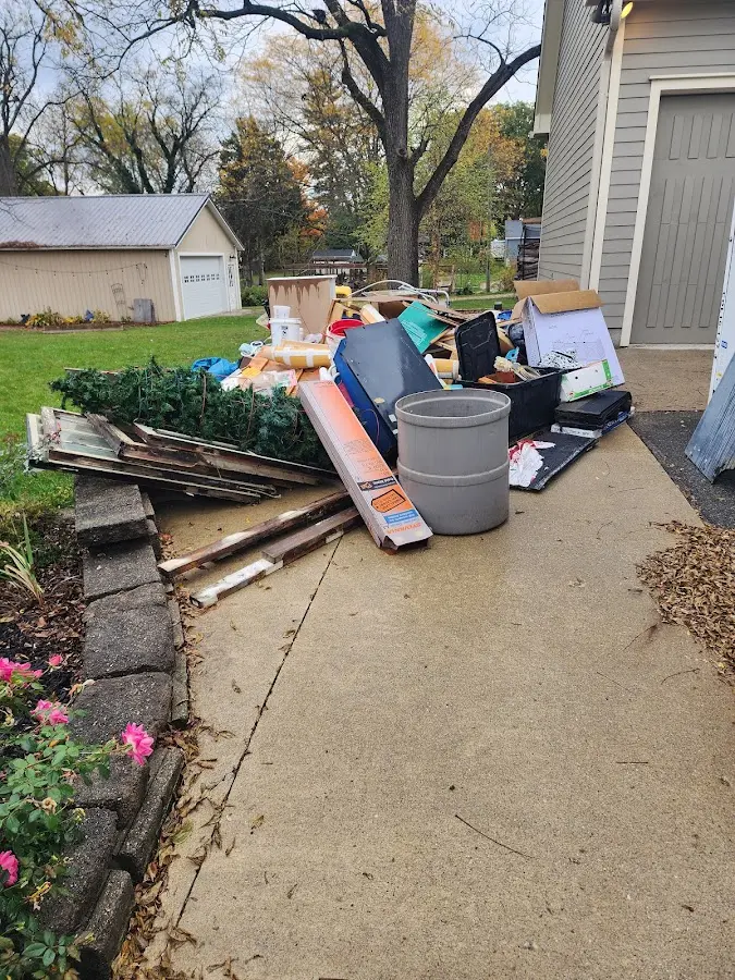 Dumpster being loaded with debris for 30 Yard Dumpster Rental in Live Oak
